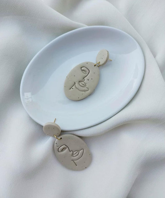 clay face earrings