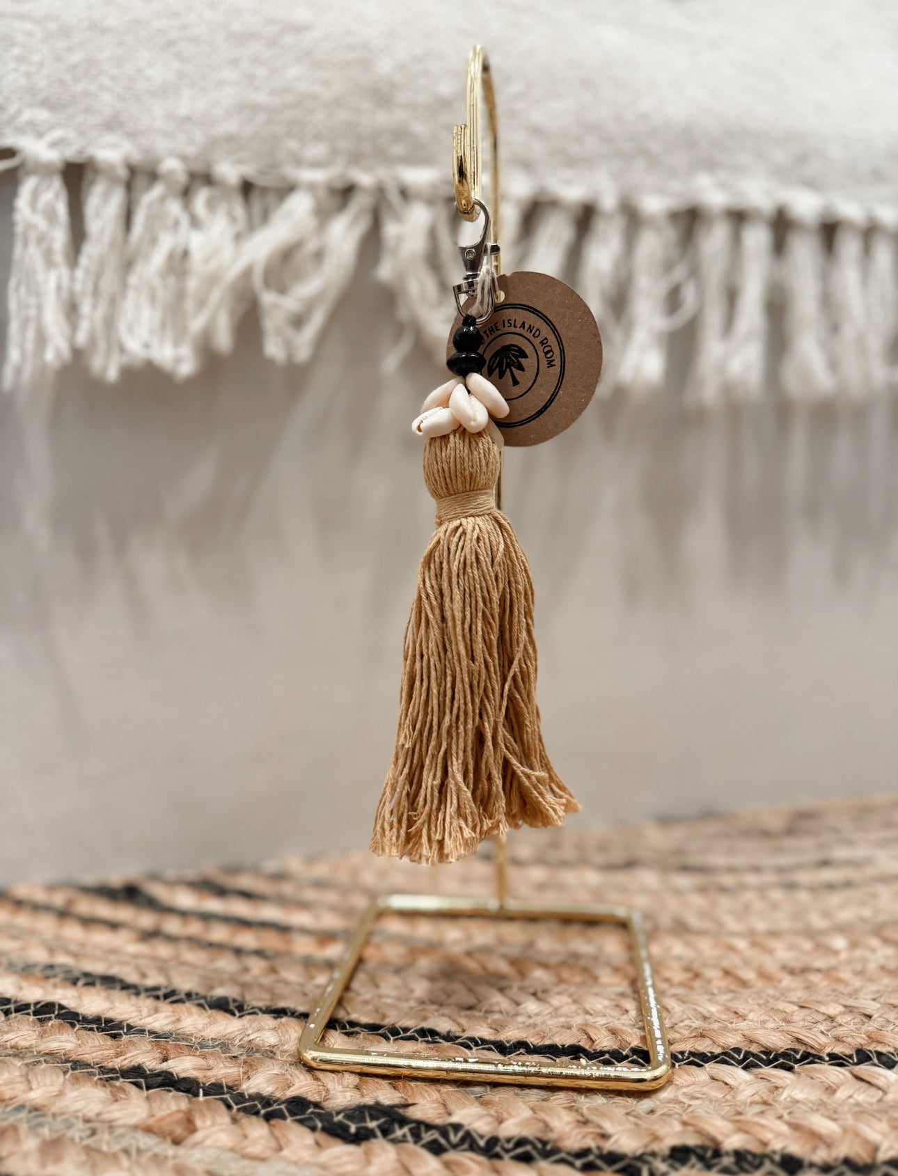 small ochre cowrie shell tassel keychain